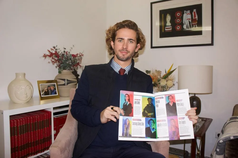 João Maria Botelho holding a magazine for Adams Magazine ESG leadership feature